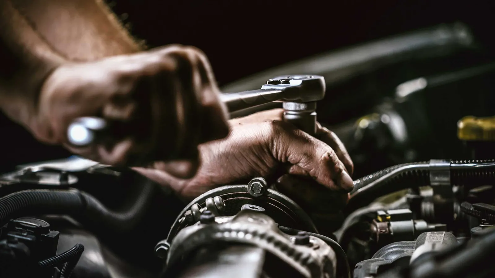 MRC Garage Services mechanic working on car engine